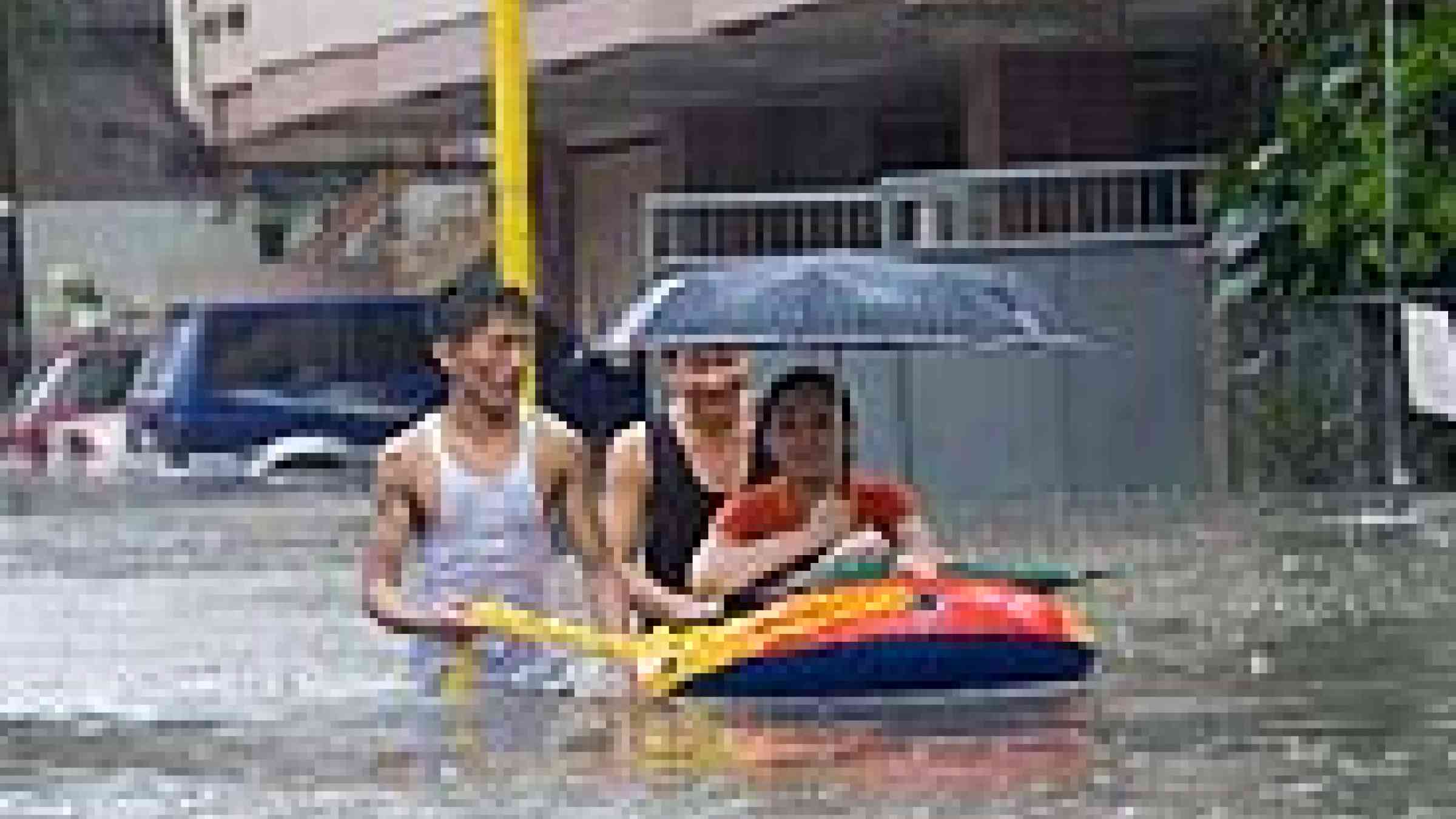 Photo of the streets of Makati, Philippines which turned into a river from heavy rainfalls caused by typhoon "Ondoy" (international name: Ketsana)  by Flickr user, Dennison Uy, Creative Attribution-Noncommercial-Share Alike 2.0 Generic