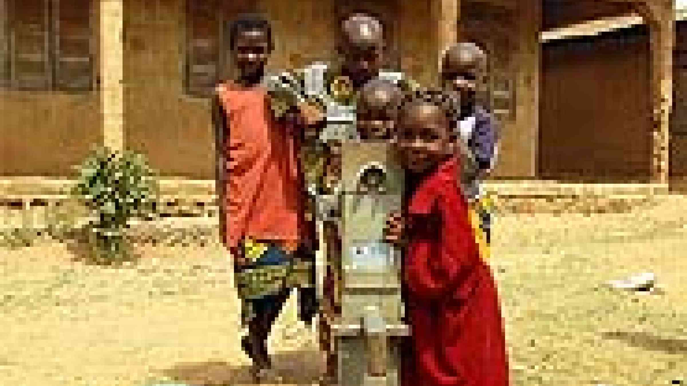 Photo of children at Nenwe central waterpump in Nigeria by Flickr user Pjotter05 Creative Commons Attribution-Noncommercial-No Derivative Works 2.0 Generic