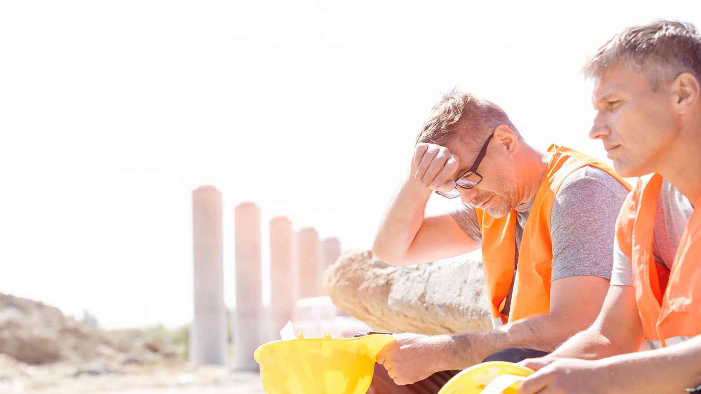 Tired workers sitting in the heat