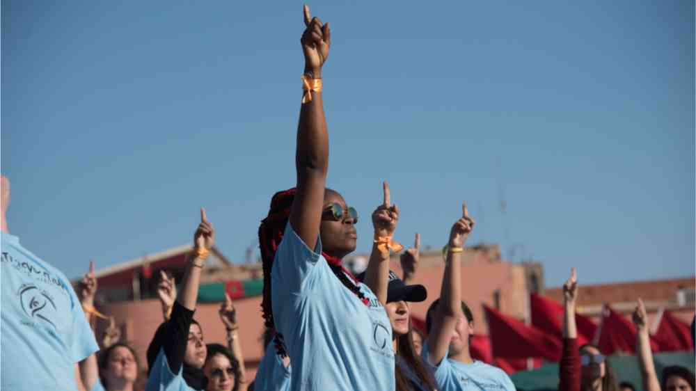 Young activists at the COP22 UN climate summit take part in a flash-mob dance protest in Jemaa el-Fnaa, the central plaza in Marrakesh, Morocco, November 10, 2016.