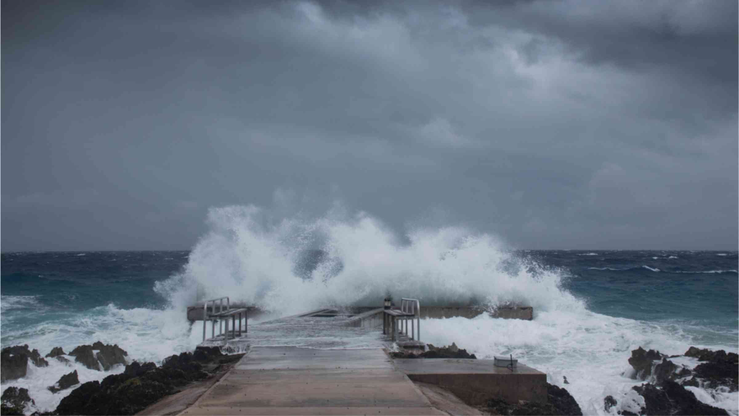 A selective focus shot of a dock in Grand Cayman as Hurricane Laura passes by