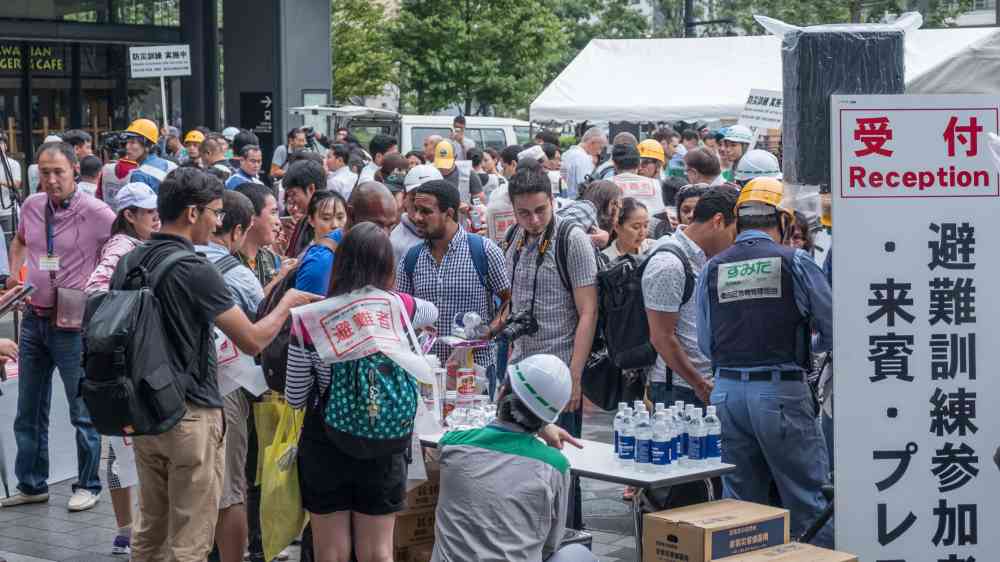 Members of the public join a disaster drill in Tokyo, Japan