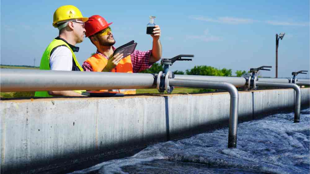 Engineers who control a water quality, activated sludge tank with aeration system in a wastewater treatment plant.