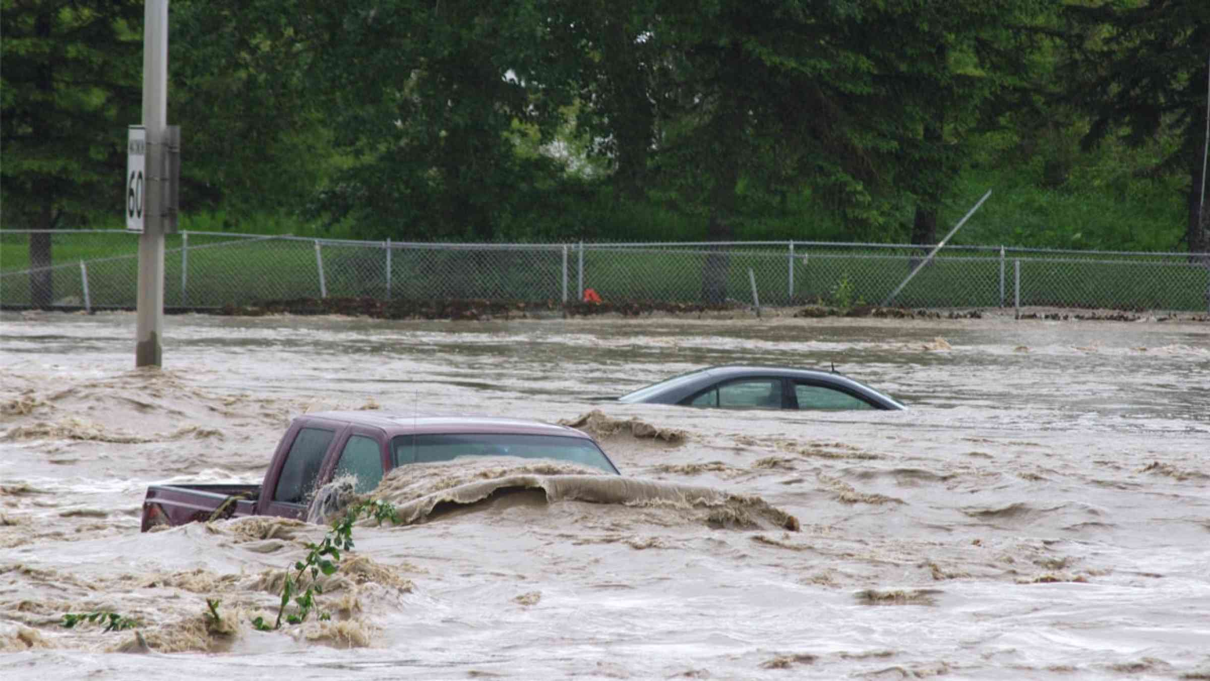 Vehicles submerged during flood in Canada