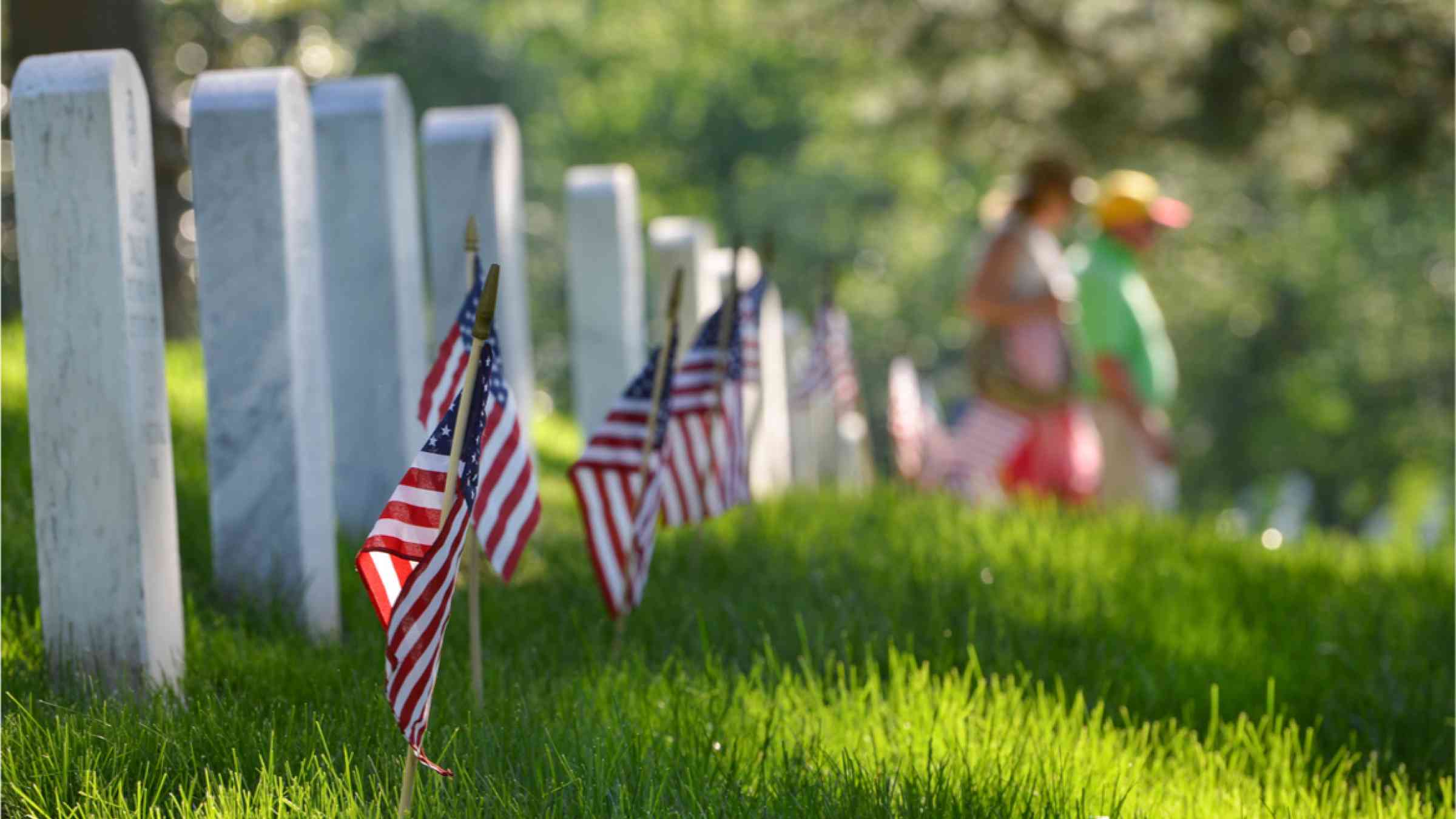 United States National flags ant headstones in National cemetery