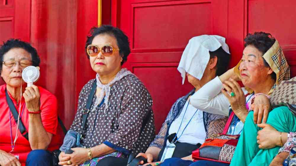 People sitting during a hot day