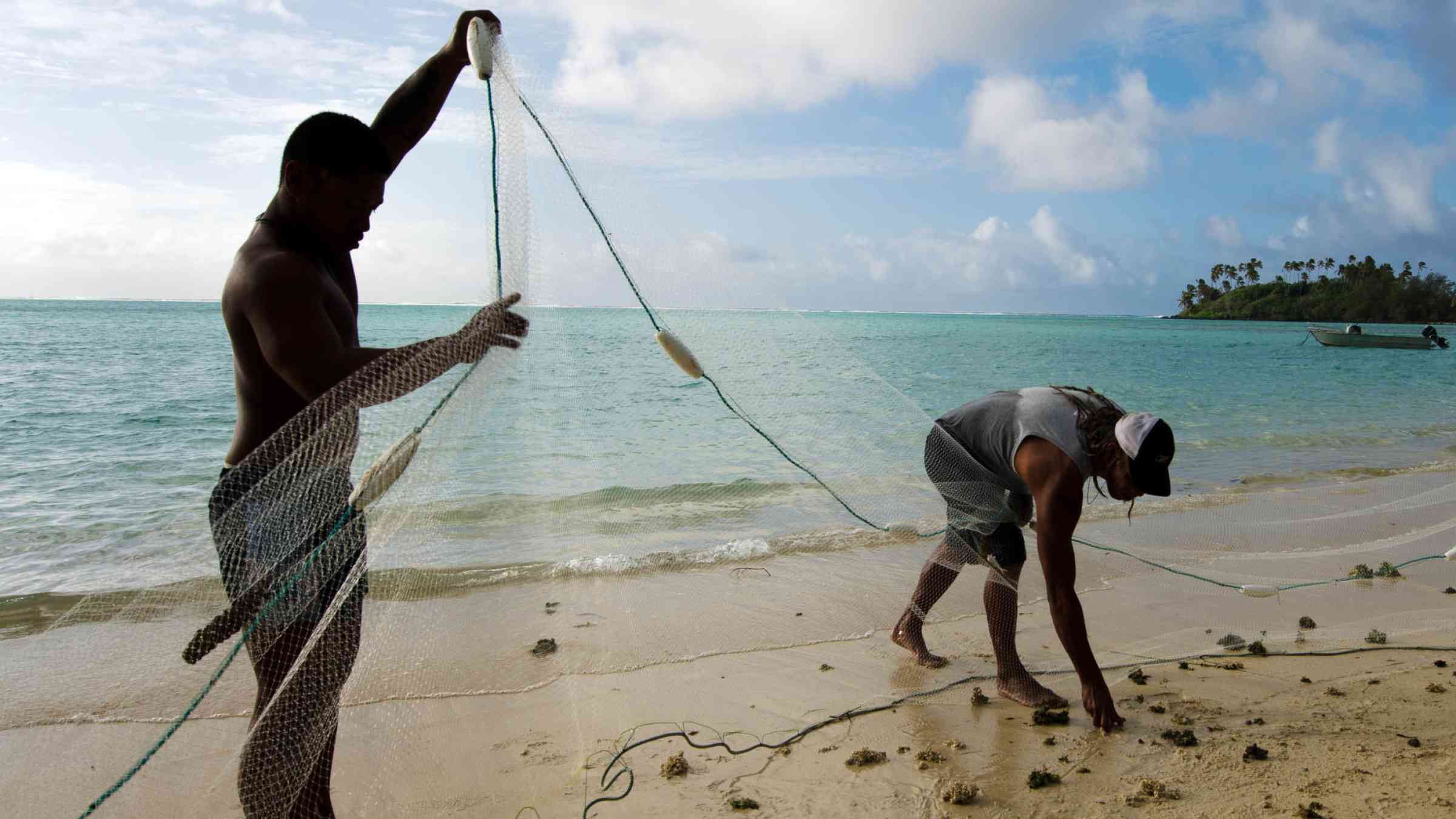 Men fishing on a beach