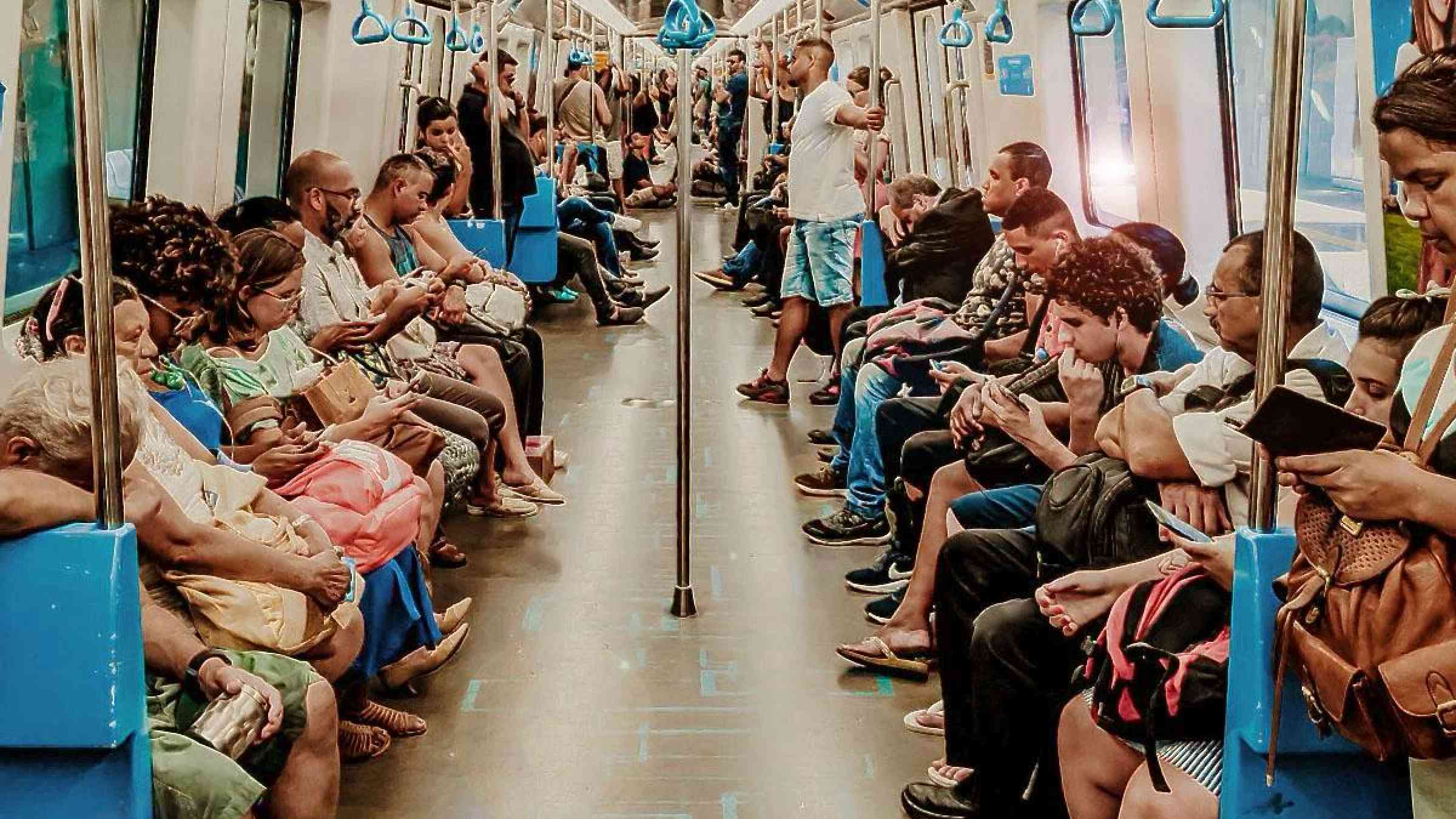 Hot commuters in subway carriage