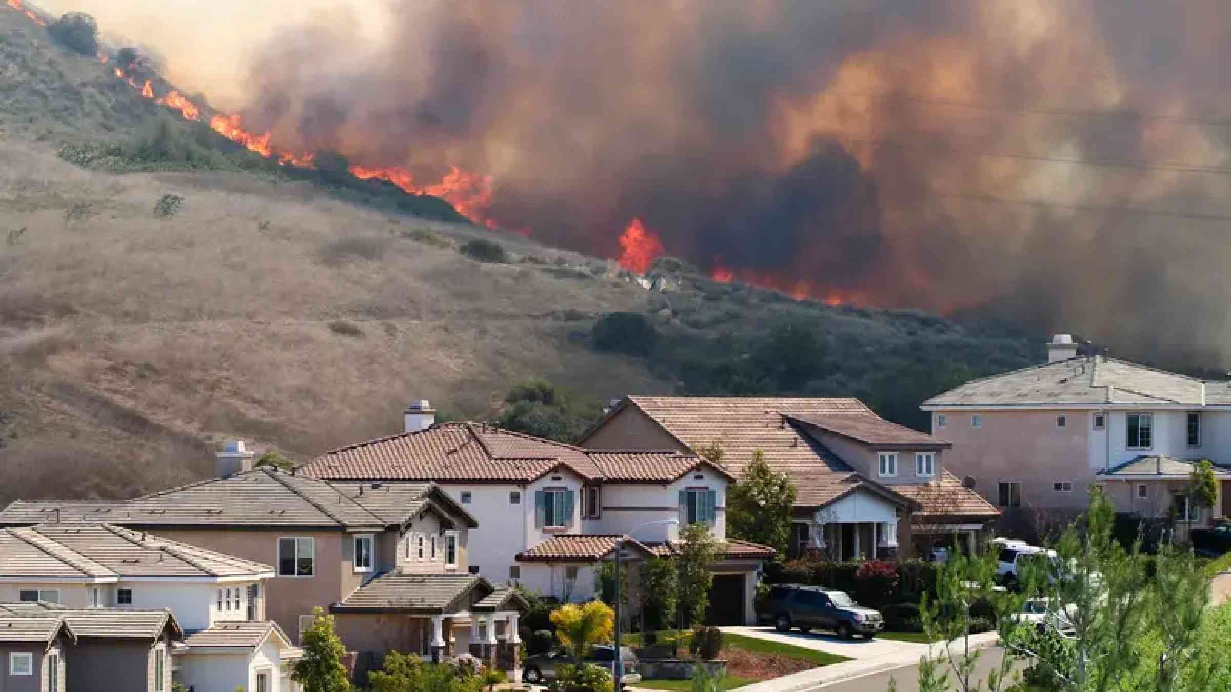 Wildfire raging near houses