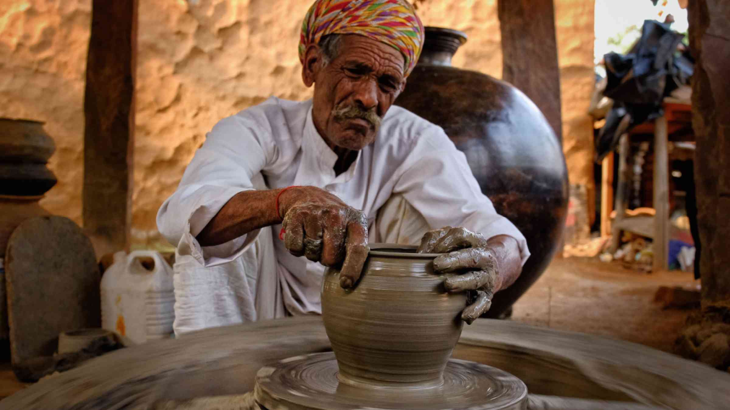 Old Indian potter at work