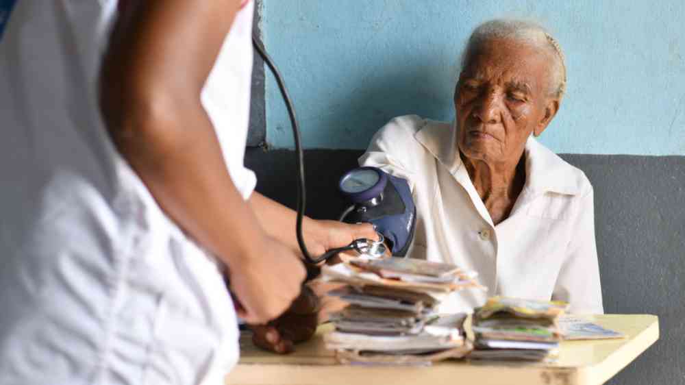 A health worker checks the blood pressure of a patient at the mobile clinic in Ankatafana, Madagascar