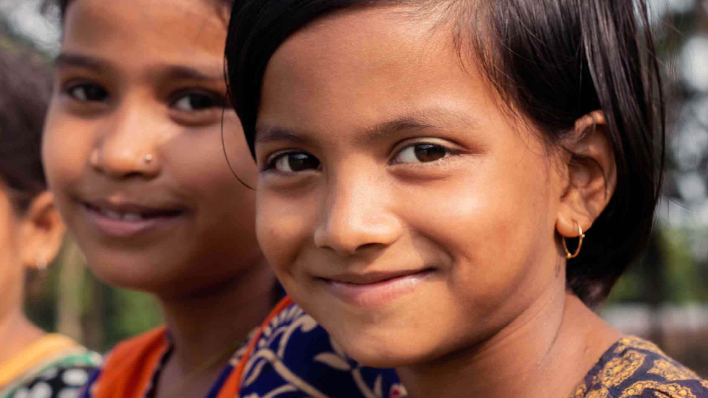 Young girls smiling at the camera