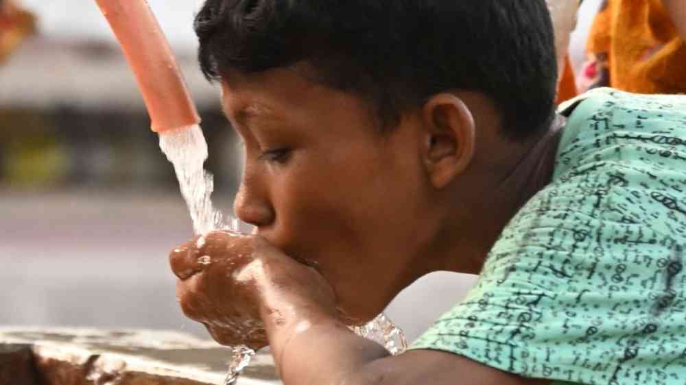 Boy drinking water in Bangladesh
