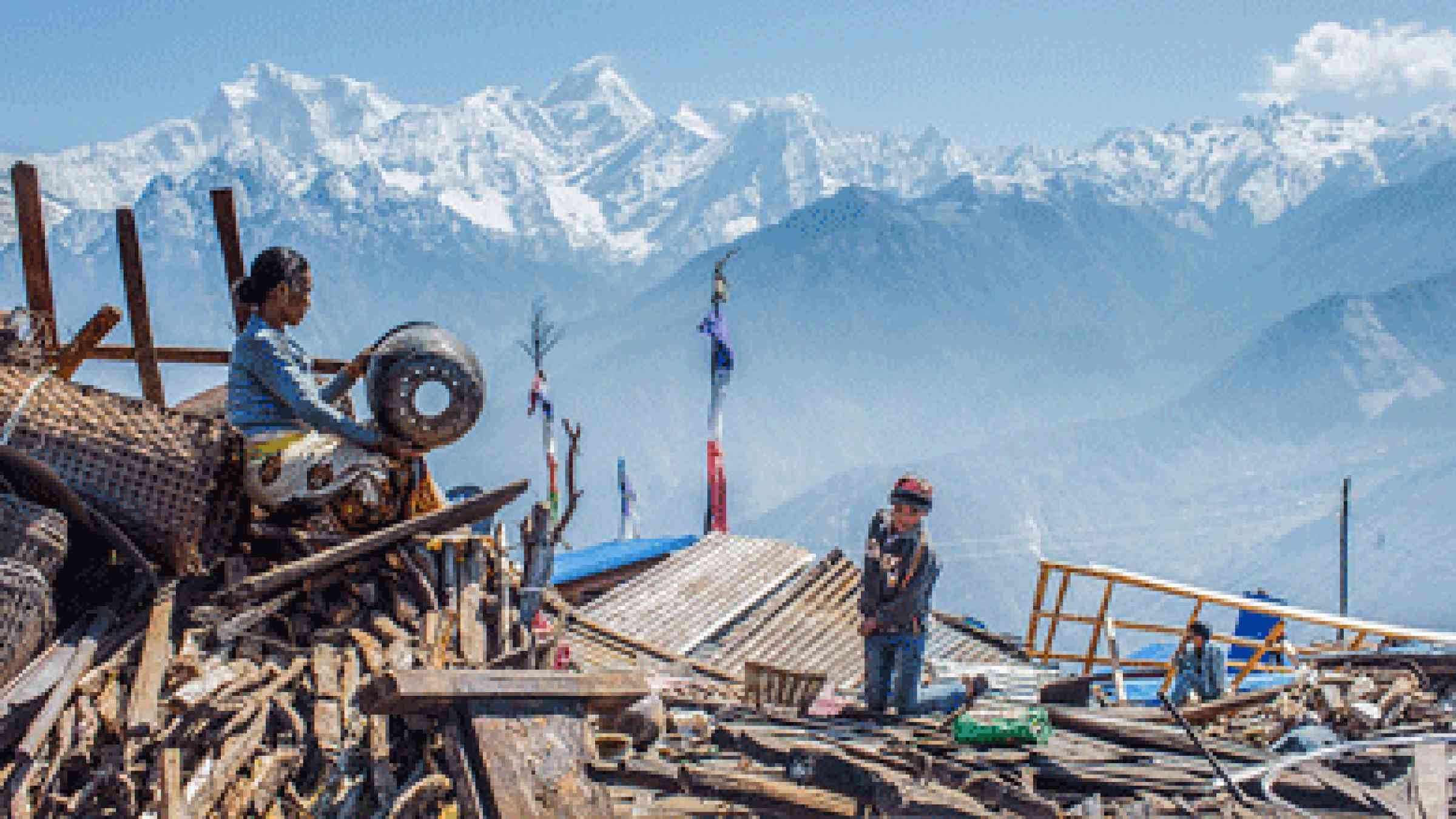 photo of a woman from Singla village extracts her belongings from the rubble following the earthquake in Nepal, by ADB, CC BY 2.0, https://www.flickr.com/photos/asiandevelopmentbank/17770081148