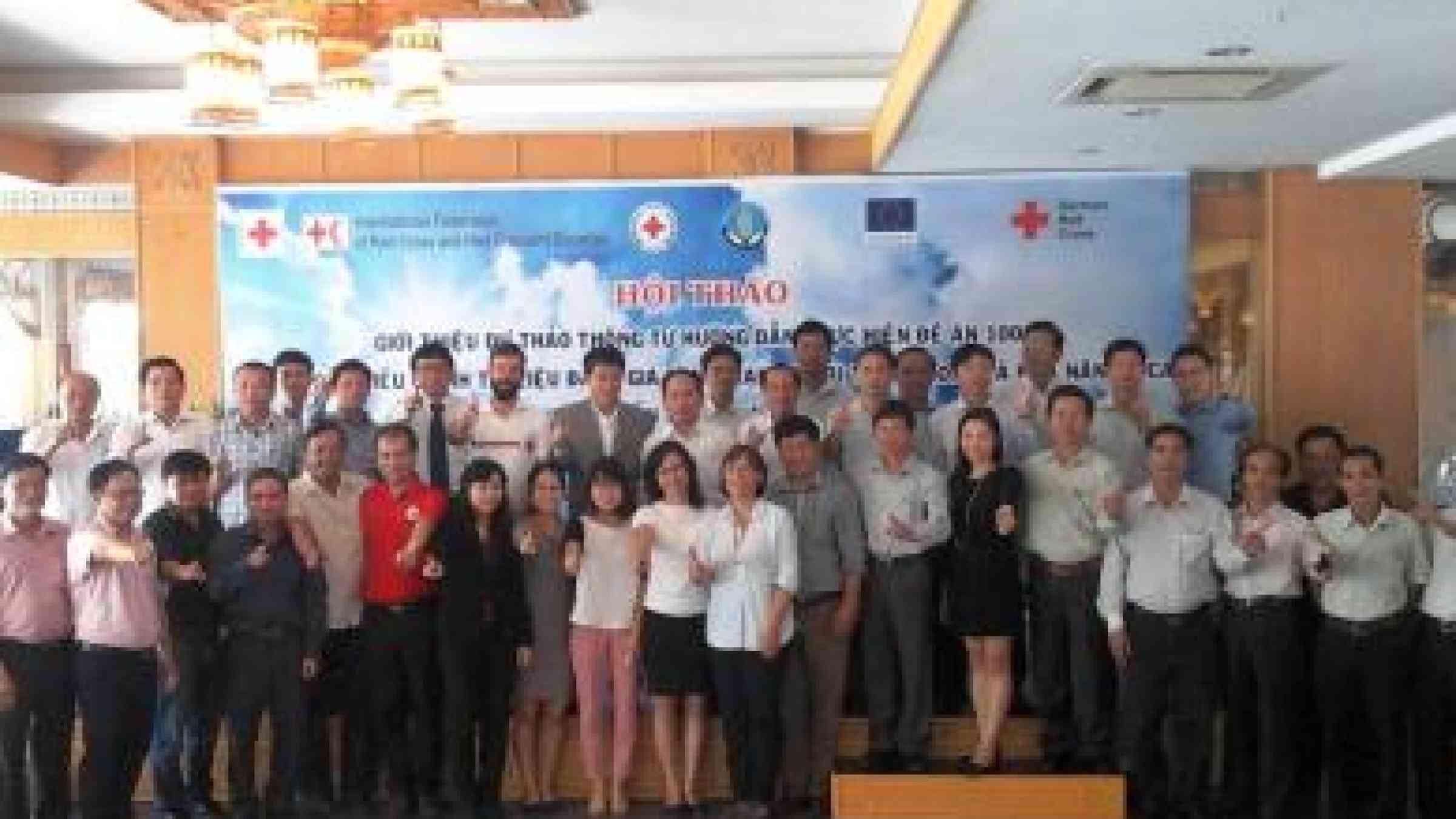 Photo by Viet Nam Red Cross Participants at the workshop uphold the ASEAN motto: 'One Vision, One Identity, One Community.