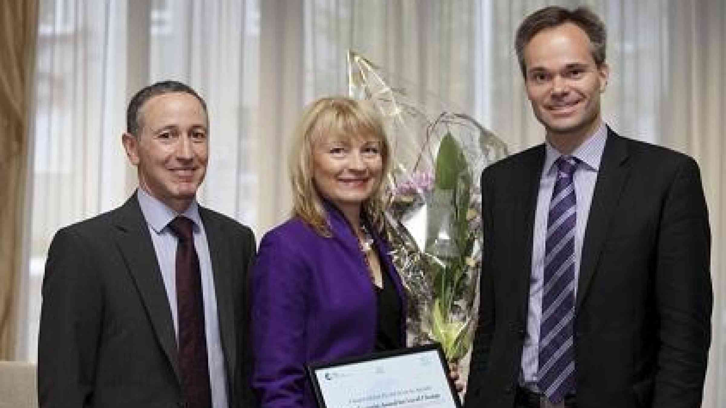 Ms. Päivi Sillanaukee (centre), Permanent Secretary at Finland’s Ministry of Social Affairs and Health, receives the Damir Čemerin Award on behalf of the Finnish Global Health Security Agenda team, from Mr. Robert Glasser (left), the UN Special Representative of the Secretary-General for Disaster Risk Reduction, and  Mr. Kai Mykkänen (right), Finland’s Minister for Foreign Trade and Development  (Photo: Pasi Autio)