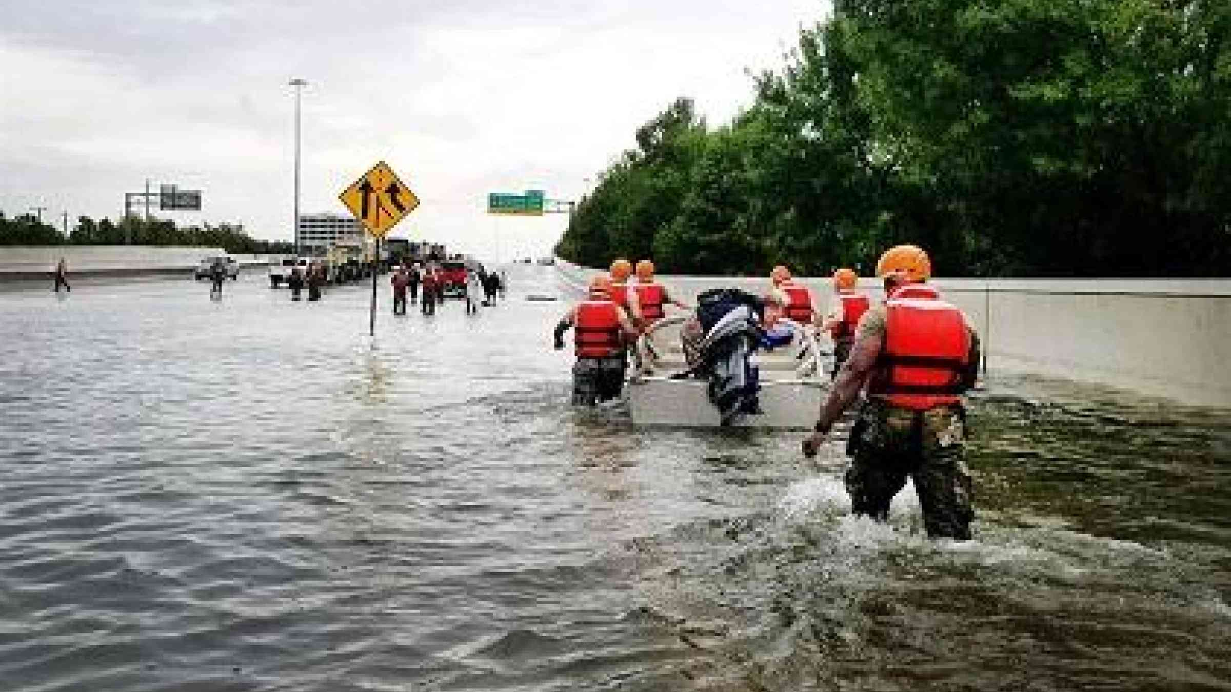 Texas National Guardsmen rescue a resident by boat during flooding caused by Hurricane Harvey in Houston, Aug. 27, 2017. Army National Guard photo by Lt. Zachary West