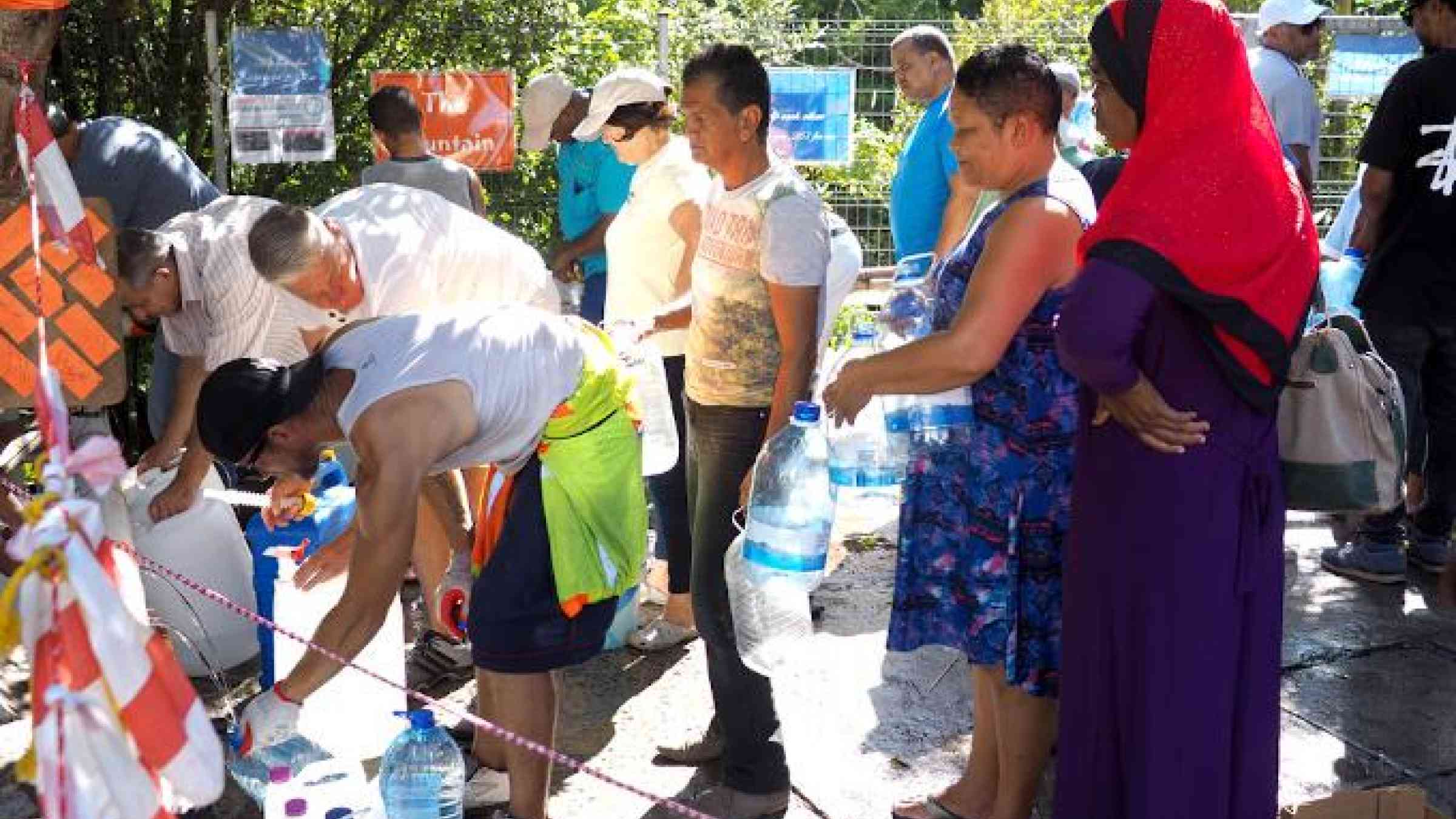 8 February 2018 - Cape Town, South Africa: Capetonians queue for water. fivepointsix/Shutterstock