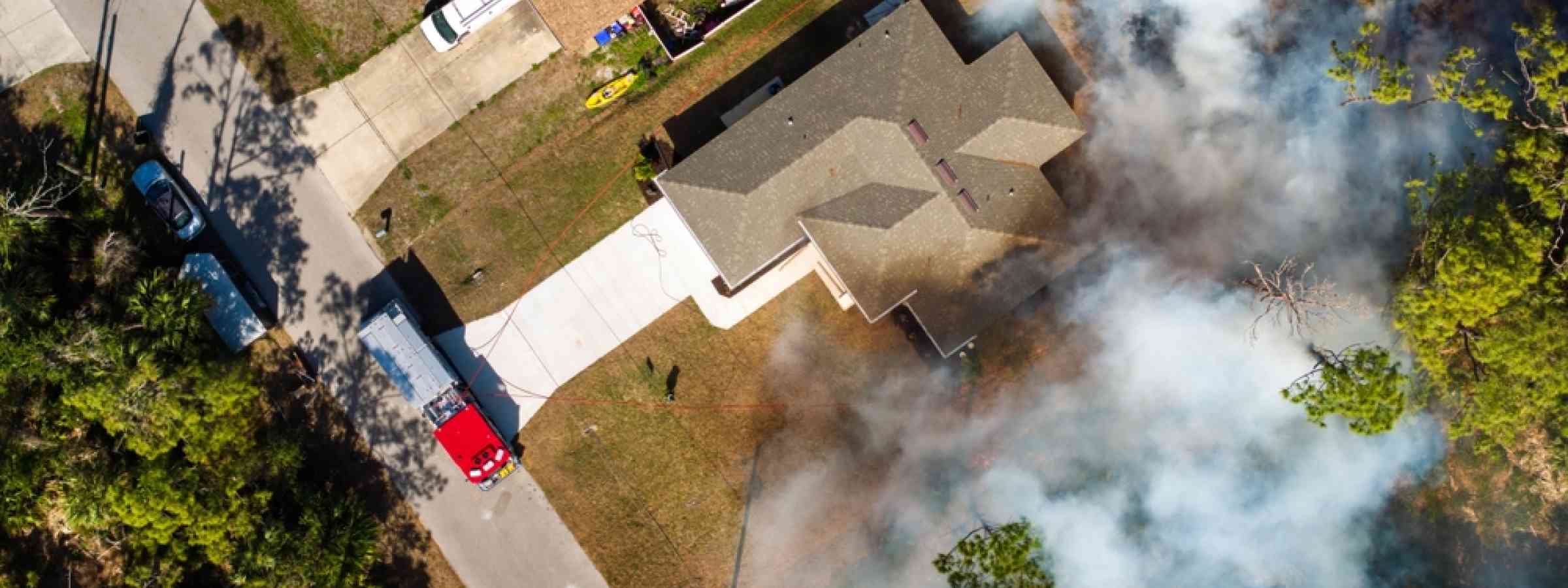 Wildfire USA Vegetation fire burns jungle forest near Florida houses as firefighters and fire trucks work to contain flames threatening nearby neighborhoods, USA (2025).